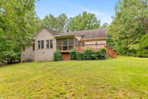 3 BR/2.5 BA brick ranch-style home on .87± acre Lake Gaston waterfront lot in the desirable Timbuctu Subdivision with a shared dock, attached 2 car garage and located in a quiet cove only 740'± from the main channel