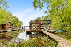 3 BR/2.5 BA brick ranch-style home on .87± acre Lake Gaston waterfront lot in the desirable Timbuctu Subdivision with a shared dock, attached 2 car garage and located in a quiet cove only 740'± from the main channel