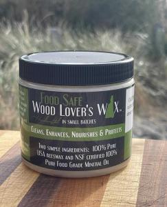 Wood Lover’s Wax — the veteran-founded, family-run brand born in New Hampshire — will launch its long-awaited Food Safe Wax and debut the Next Generation of Makers Award at the 3rd Annual New England Woodworking Competition, hosted by the Guild of New Hampshire Woodworkers on Sunday, November 9, from 3–8 PM in the Granite State Room at the University of New Hampshire in Durham Wood Lover’s Wax Food Safe Wax jar displayed on a striped wooden board with natural background.