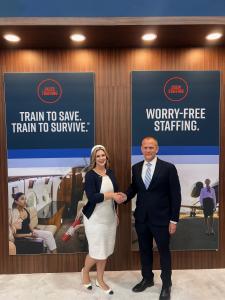 Karl Kamps of Aircare International and Ericka Essington of Air Nurses shake hands at an event to enhance in-flight medical support services.