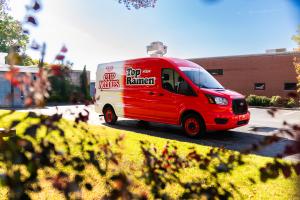 Nissin Foods USA, maker of Top Ramen® and Cup Noodles®, announces the launch of the Nissin Hot Water Van, an instant ramen sampling vehicle bringing Nissin’s flavor directly to communities across the U Nissin Foods Ramen Roadshow vehicle with Top Ramen and Cup Noodles logos, shown in a parking lot