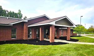 Neighborhood Roofing, a trusted roofing contractor with hundreds of 5-star reviews, serving Ann Arbor and surrounding areas since 1976, has moved into a new, significantly larger facility located at 1377 Tefft Ct, Saline, MI 48176 Picture of outside on Neighborhood Roofing's New Location showing a red brick building