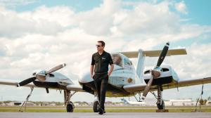 Sun City Aviation Academy's Chief Pilot in front of a Beechcraft Duchess, Sun City's Multi Engine Trainer