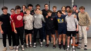 Hockey players standing together after participating in a Shiftmakers Tour session focused on mental health and leadership.