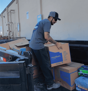 Valley Haul-Off crew unloading donated items at a local charity drop-off site, supporting recycling and community reuse initiatives in Tulare County.