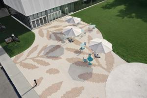 Public Space using Techo-Bloc's Industria HD2 Granitex pavers in Chestnut Brown and Beige Cream