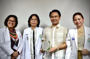 Rotary Club of New Manila East President Karlo Benjamin Nisce receives Service Award for leading $72,000 Philippines-Korea Rotary Global Grant delivering advanced medical equipment to Quirino Memorial Medical Center, joined by QMMC Dermatology Chair Dr. H