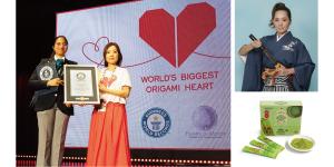 Machiko gozen holding the award for World's Biggest Origami Heart Guinness World Record