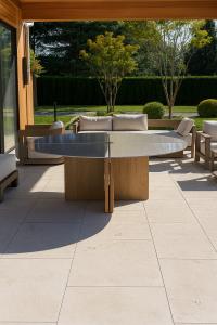 Formhaus, a New York–based architectural woodworking studio, has completed a custom outdoor table for a modern Westhampton residence Custom white oak table with brushed metal top by Formhaus in Westhampton, NY