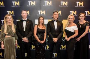 TM Team and Joseph Valente