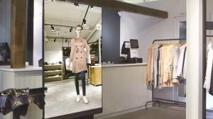 Virtual On team managing Fashion Mirror content and performance remotely from the control platform.