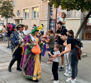 Tampa Florida USA based Krewe of Europa®, a 501c3 social and philanthropy organization with members spanning the United States and Europe has announced they are traveling to Pernik Bulgaria January 16th to 18th , 2026 to appear in the 2026 Pernik carnival Krewe members Karen Bachler and Craig Bachler handing out custom trinkets to parade spectators