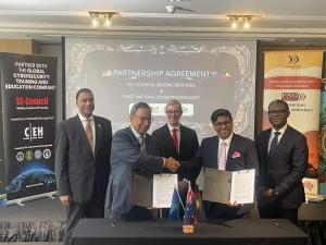 Jay Bavisi signing the MOU