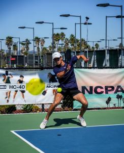 Player hits a forehand with the JOOLA HC-40, the official ball of the 2025–2026 NCPA season.