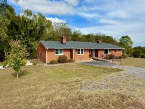 4 BR/2 BA brick ranch/rambler style home with unfinished walk-out basement on 1.49 +/- acres, individual entrances, handicap ramp
