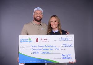 Andrew Draayer of Andrew The Home Buyer standing with a giant check donated to St. Jude in 2024