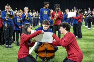 Two student mentors assist United Sound student.