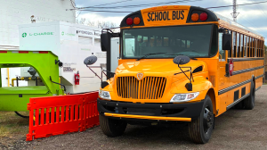 Federal funding is fuelling an unprecedented boom in electric school buses across the U Pontiac EV bus being charged by L-Charge Unit