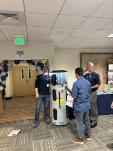 Super Brothers Plumbing, Heating & Air technicians presenting an ENERGY STAR heat pump water heater system during a Peninsula Clean Energy workshop in San Jose, California.
