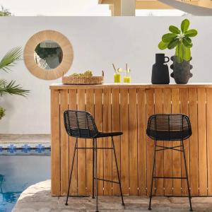 Durable outdoor rattan furniture Dubai under shaded pergola