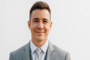 Gabriel Killian professional headshot photo, founder of Memorial Merits and bestselling legacy journal author, wearing business attire