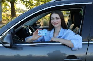 Texas adult student holding a learner permit after finishing the state-approved Adult Drivers Ed course.