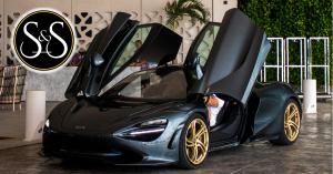 Sun and Speed Black McLaren with gold wheels at concierge Luxury Avenue Mall Cancun