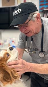 Dr. John Sangiorgio of the NYC Project Street Vet team, providing care at a community clinic event.