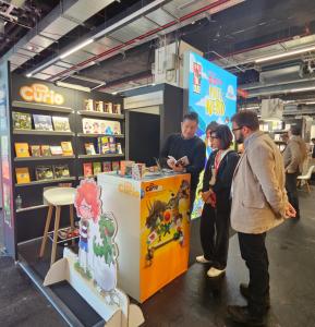 Scene from the joint booth of PLAYCURIO and Almond Entertainment at Frankfurt Book Fair