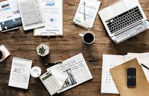 Table with papers, charts, and planning materials representing data-driven e-commerce strategy and marketing insights.