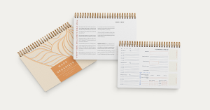The Mood Organizer wellbeing planner collection featuring three cover designs in a clean, minimalist setup Glimmery Moments®