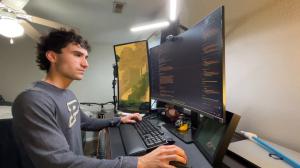 Maddox Schmidlkofer working on DuckMath in his apartment at Purdue University (November 2025)