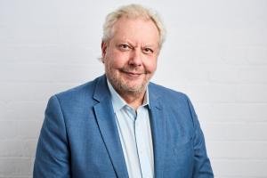 Richard White portrait in blue suit jacket