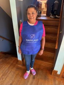 Professional cleaner from Maryland Spotless Maid Service cleaning a client’s home.