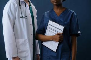 Dr, and Nurse in scrubs and lab coat by Work Hard Dress Right