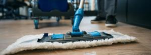 person mopping the floor