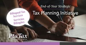 A promotional graphic for PTA Tax featuring a close-up of two people reviewing and signing documents. The text reads “End-of-Year Strategic Tax Planning Initiative” and includes a speech bubble saying “Bilingual Tax Services – Servicios Bilingües.” The PT