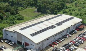 A wide rooftop solar array installed by Solaren at Toyota Dasmariñas, showing photovoltaic panels across the dealership’s main building.