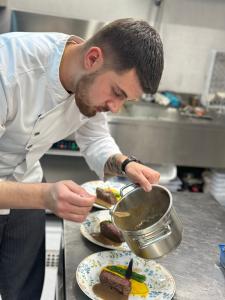 Albania’s culinary voice is growing louder on the international stage, and Chef Kevjano Shehaj is one of its most eloquent translators A chef carefully finishes plating several dishes by spooning sauce from a small pot, according to the user identified as Kevjano Shehaj.