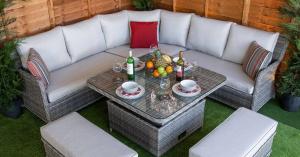 Rattan Garden Furniture LTD rattan garden furniture corner dining set with cushioned seating and glass-top table, perfect for outdoor dining and relaxation.