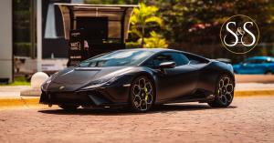 Lamborghini Huracan Tecnica 60th Anniversary Edition in Satin Black in front of Valet at Luxury Avenue Boutique Mall in Cancun Mexico