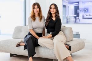 Floriana and Kristina in RENTAL12 office on a sofa in olbia