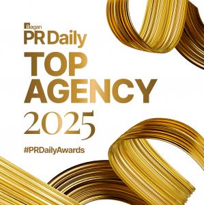 Gold text reading "PR Daily Top Agency 2025 #PRDailyAwards" on a white background
