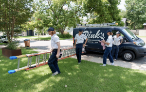 Pink's Window Cleaning Service setting up for a job