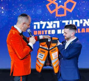 United Hatzalah of Israel honored former Mossad Director Yossi Cohen, former U President & Founder of United Hatzalah presenting former hostage Bar Kuperstein with his new personalized medic vest