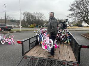 Garage Door Doctor employee Loading Bikes on a trailer