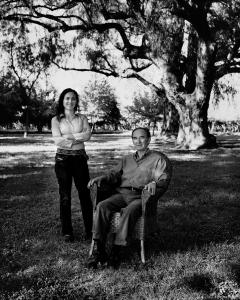 a father and daughter in a garden