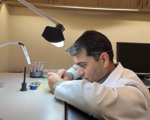 Suleman Qureshi, accredited Swiss watchmaker, restoring precision to a luxury mechanical timepiece