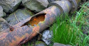 corroded cast iron pipe with major damage in university park, tx backyard