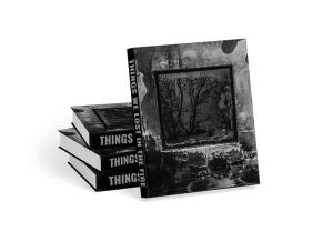 Things We Lost In The Fire Large Format Photography Book displayed leaning against a stack of other Hard Cover copies.